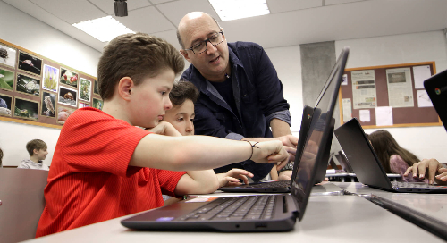 Teacher observing students in the classroom